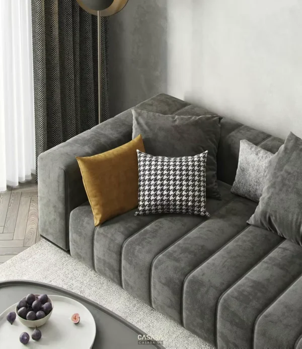 Góc phòng khách hiện đại với ghế sofa màu xám tro ấm cúng.