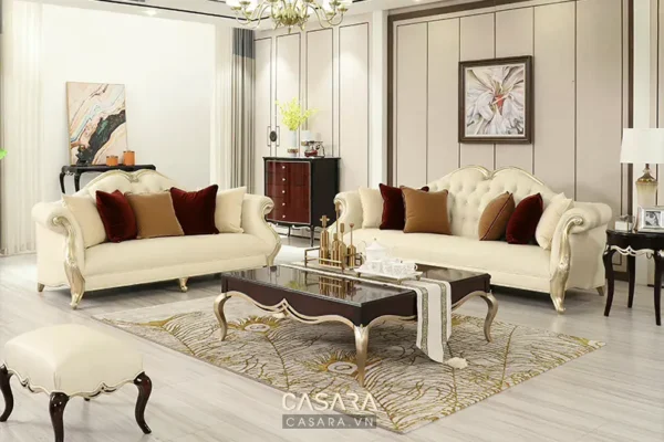 Phòng khách sang trọng với sofa trắng, gối màu và thảm hoa văn đẹp mắt