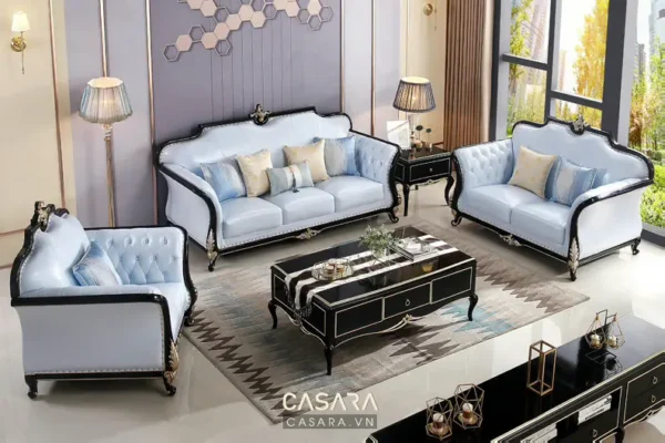 Phòng khách sang trọng với bộ sofa màu xanh nhạt.