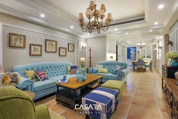 Phòng khách hiện đại, sang trọng với sofa xanh da trời nổi bật.