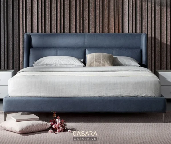 Giường ngủ hiện đại, màu xanh than, thiết kế đầu giường cong mềm mại.