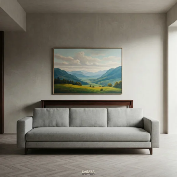 Phòng khách nội thất phong thủy có sofa xám, bàn console gỗ và tranh sơn thủy phía sau.