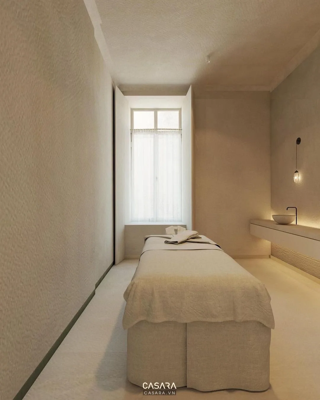 Phòng spa nhỏ tối giản có giường trị liệu, ánh sáng dịu và bề mặt sạch dễ vận hành.