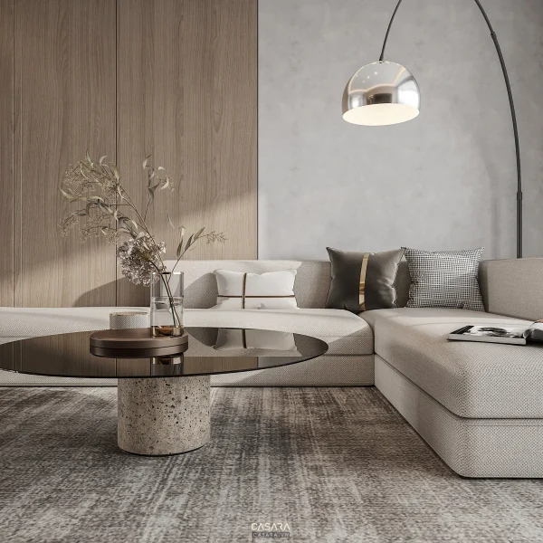 Phòng khách chung cư tông xám với sofa module màu trắng, đèn cây và bàn trà tròn.