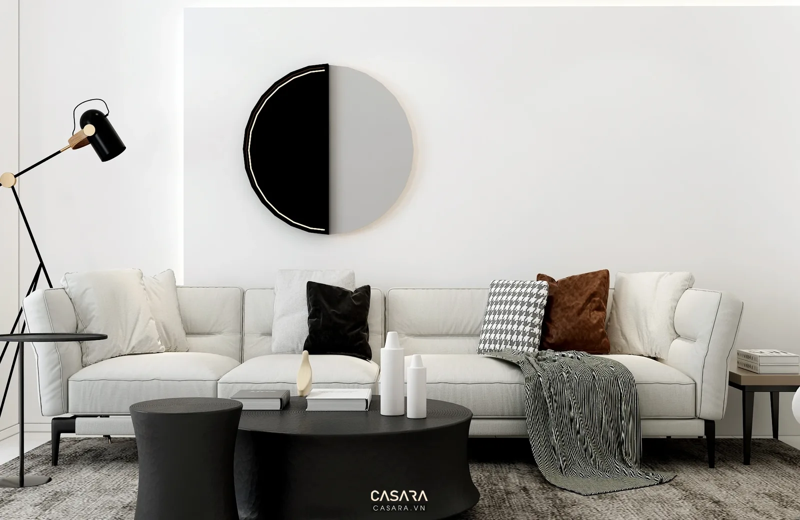 Sofa trắng chữ L với bàn trà đen và đèn đọc sách