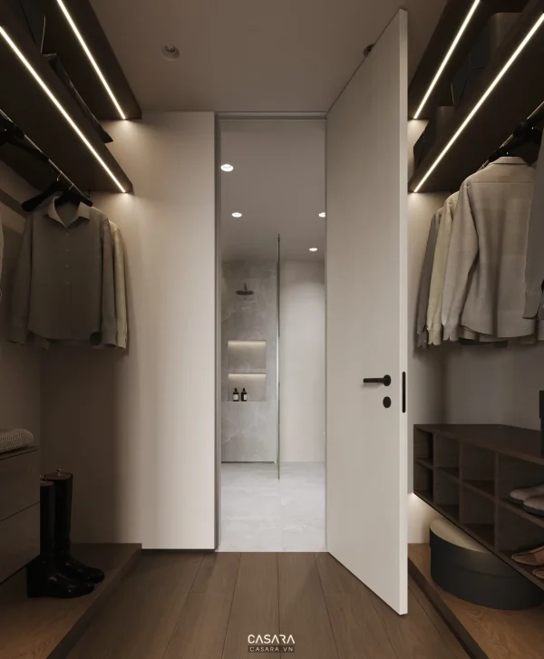 Ảnh tủ áo phòng thay đồ phong cách Indochine trắng sáng với khoang treo, kệ mở, cánh kính và lối đi dài trong thư viện Casara.