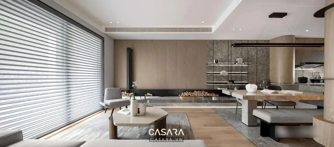 Sofa trong phòng khách rộng cho thấy tỷ lệ đồ lớn cần đi cùng tủ kệ thấp.