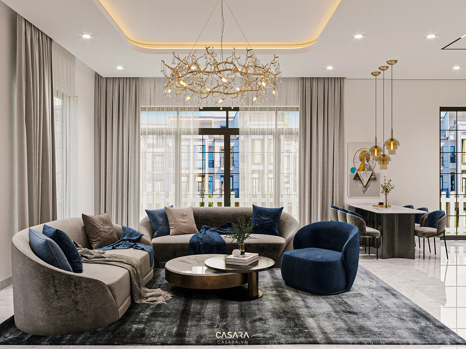 Phòng khách hiện đại với sofa cong, ghế xanh, đèn chùm và khu bàn ăn phía sau