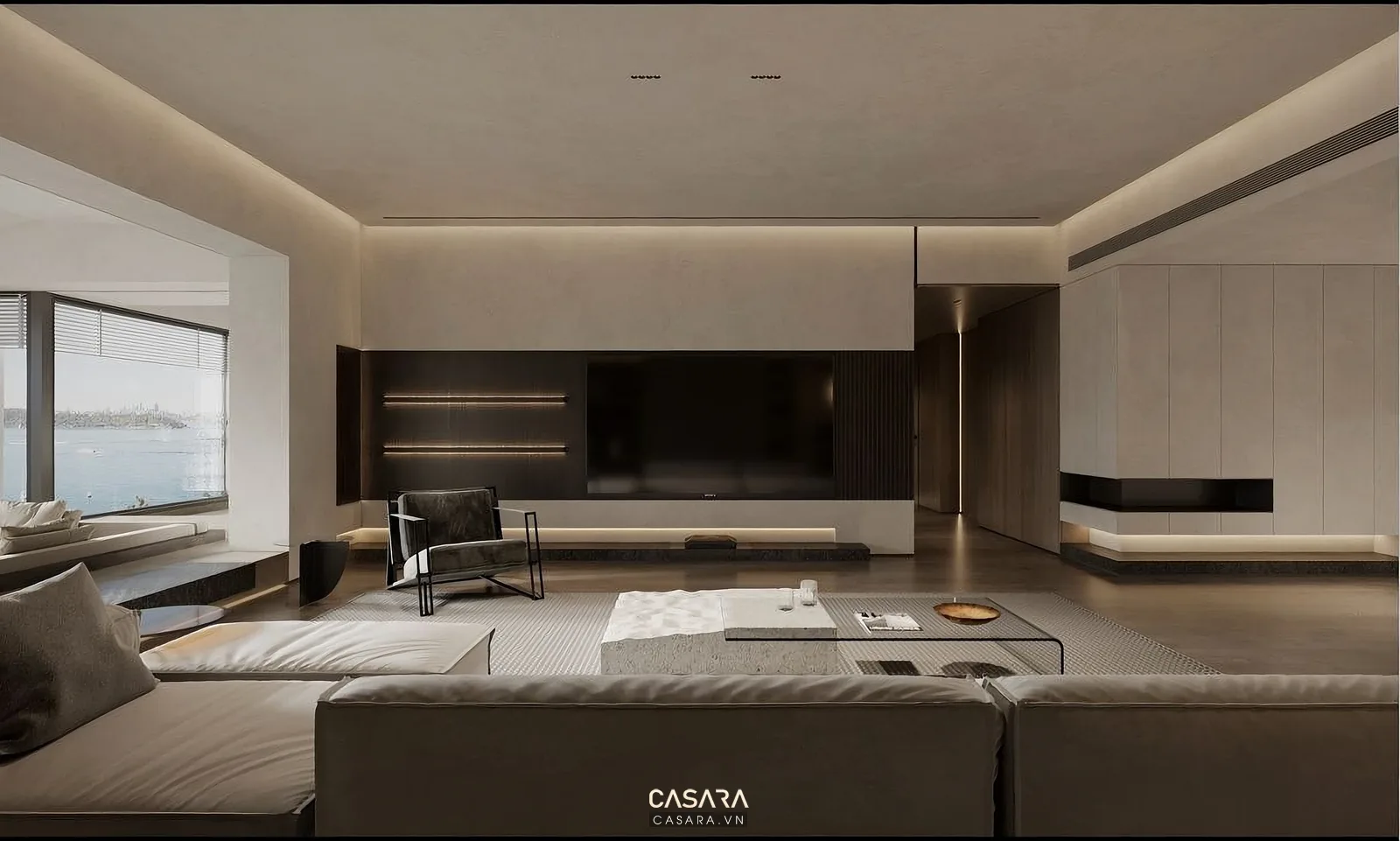 Phòng khách rộng với sofa, bàn trà và tủ kệ âm tường