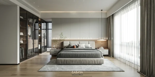 Phòng ngủ hiện đại tông xám với giường thấp, hệ tủ và ánh sáng trần có watermark Casara
