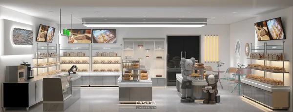Không gian showroom bánh sáng màu với kệ trưng bày, quầy kính và khu bàn ghế nhỏ