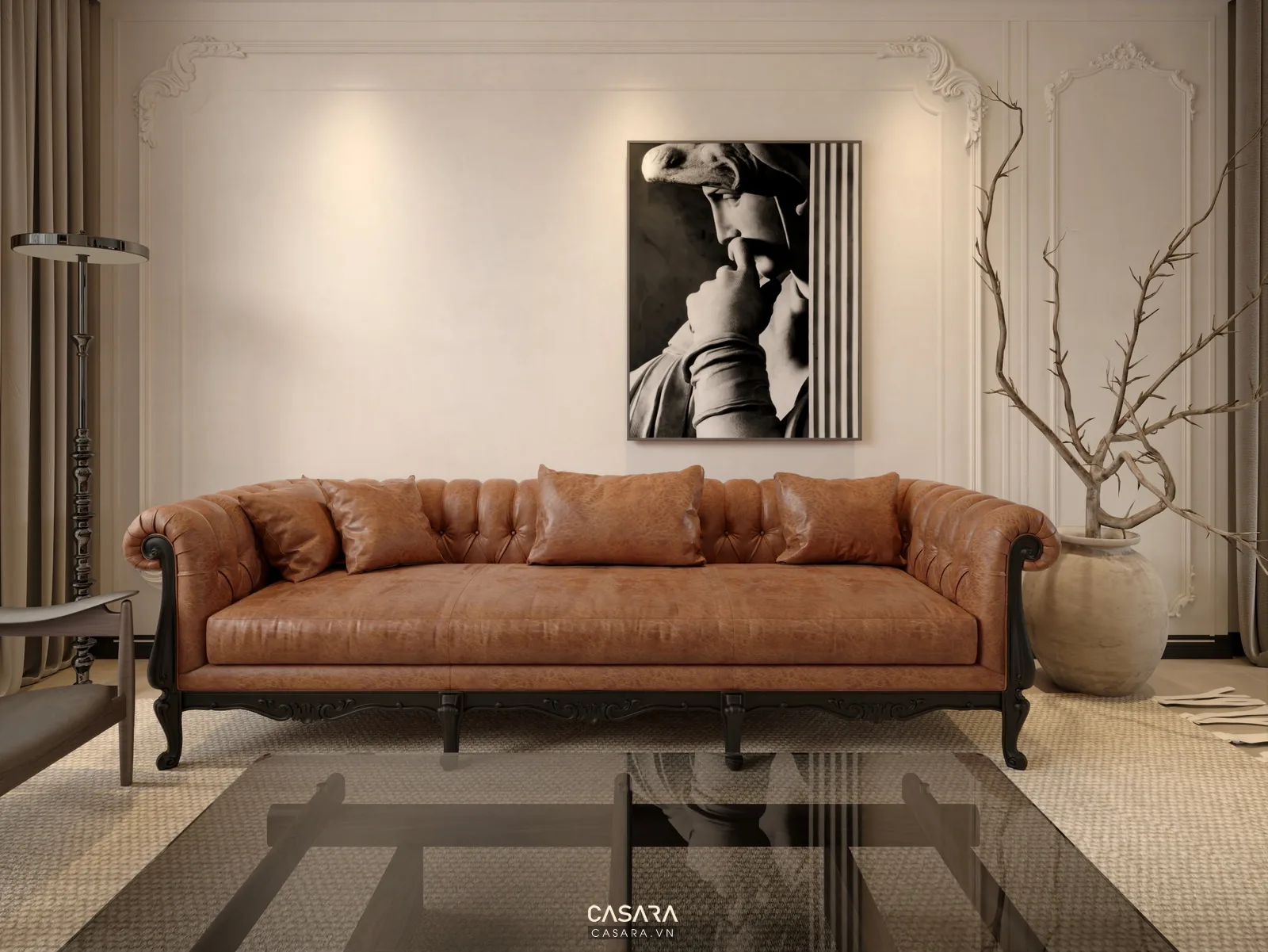 Phòng khách sáng có sofa bo tròn màu be, ghế đôn cam, bàn trà và tranh tường