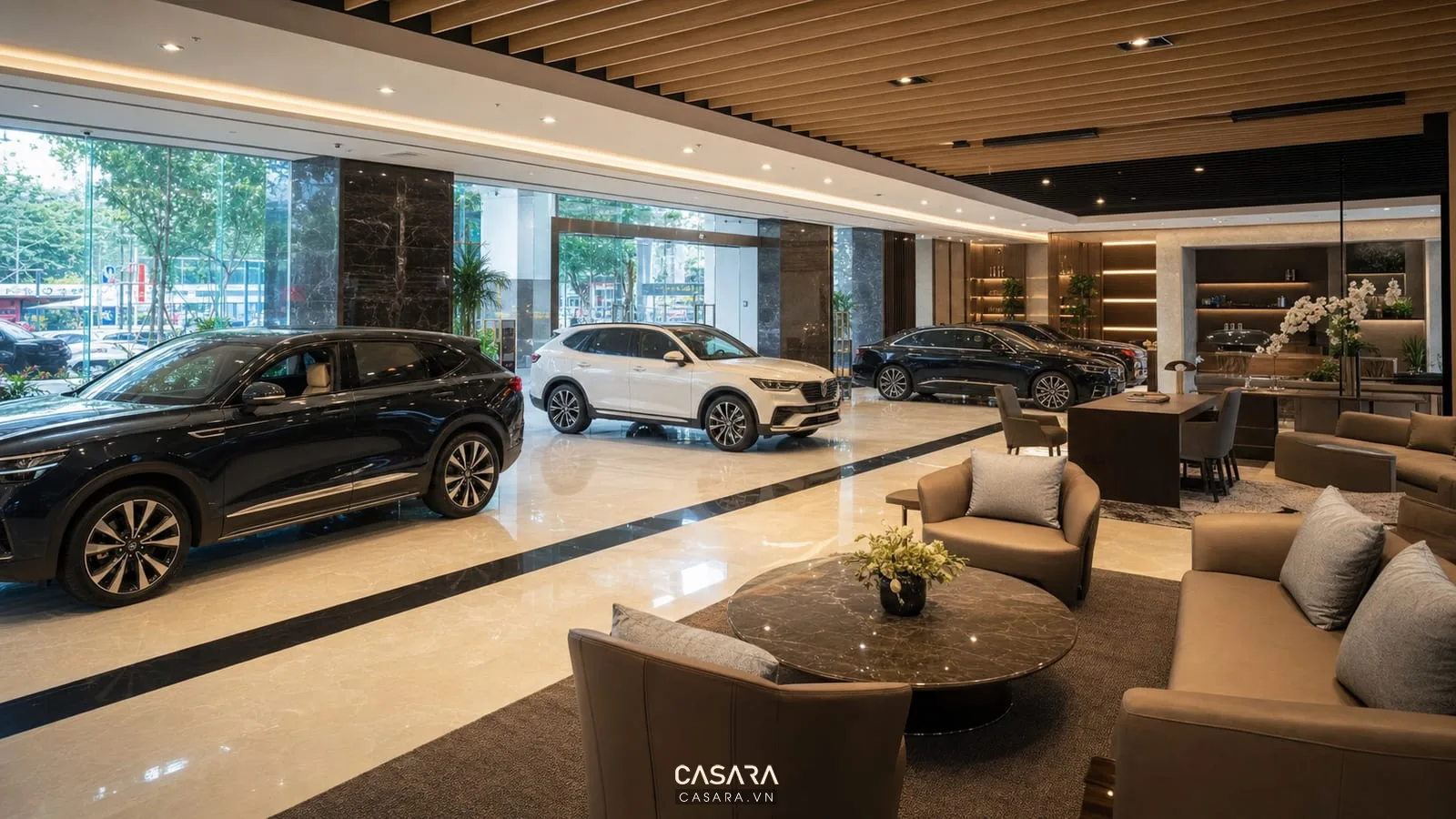 Tổng thể showroom ô tô sang trọng với nhiều xe ô tô khu tư vấn và lối đi thông thoáng