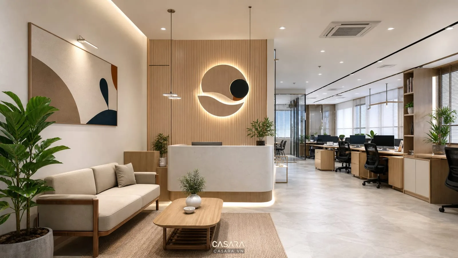 Khu tiếp khách trong mẫu thiết kế văn phòng công ty 100m2 với sofa và logo thương hiệu