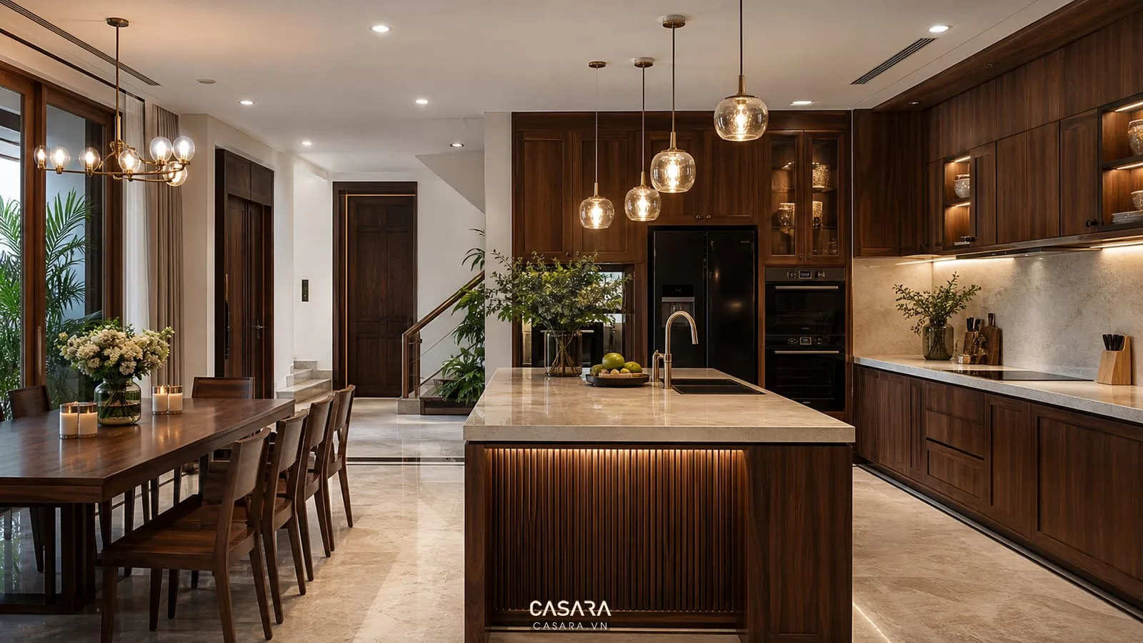 Thiết kế thi công nội thất biệt thự với bếp gỗ óc chó đảo bếp tủ cao mặt đá và bàn ăn lớn