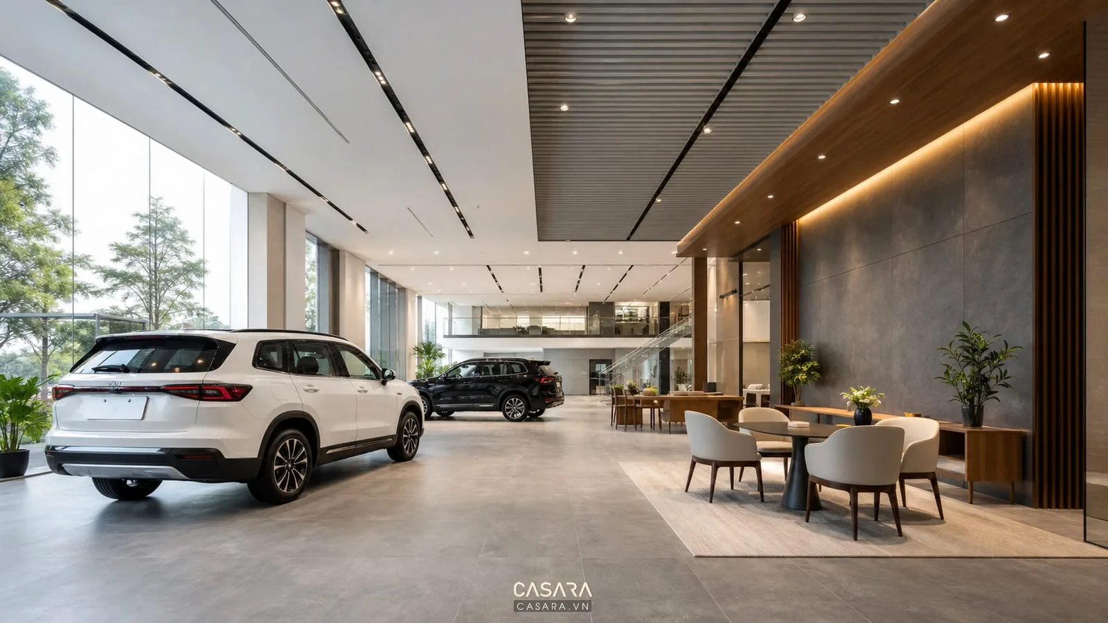 thiết kế showroom xe hơi với ô tô trưng bày lối đi rộng ánh sáng trần và khu tư vấn khách hàng