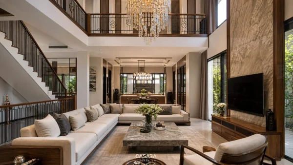 Thiết kế nội thất biệt thự cao cấp với phòng khách thông tầng sofa lớn vách tivi và đèn chùm