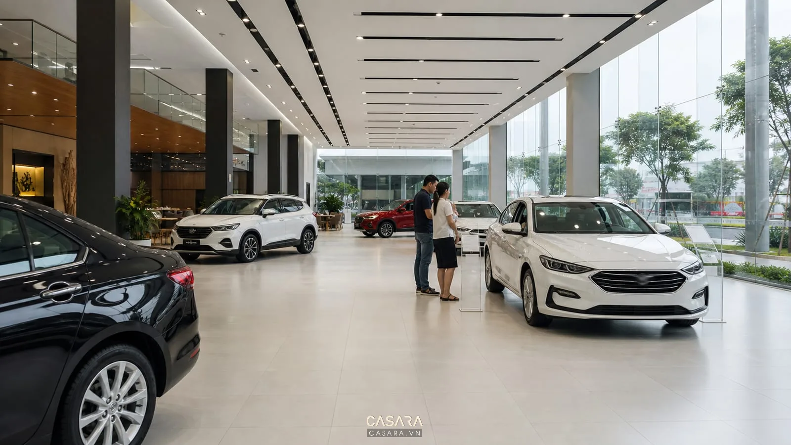 khu trưng bày xe hơi trong showroom ô tô với lối đi rộng và ánh sáng tốt