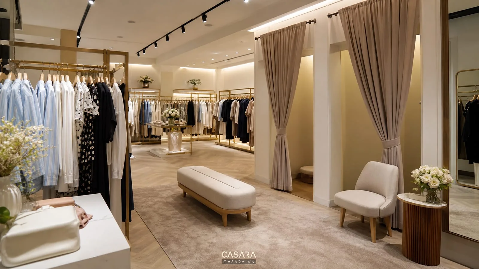 showroom quần áo có rèm phòng thử đồ ghế chờ và kệ treo áo váy