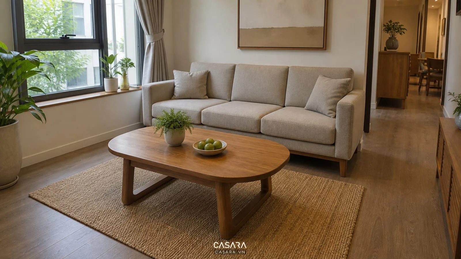 bàn trà phòng khách bằng gỗ dáng oval bo góc trong phòng khách nhỏ có sofa chữ I và thảm dệt phẳng