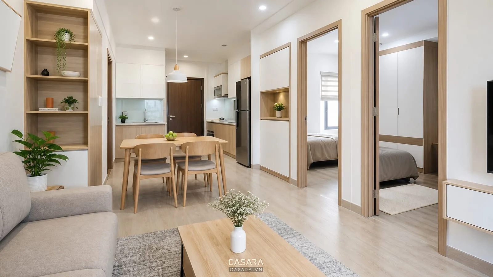 căn hộ chung cư nhỏ có phòng khách bếp mở sofa gọn bàn ăn và tủ âm tường