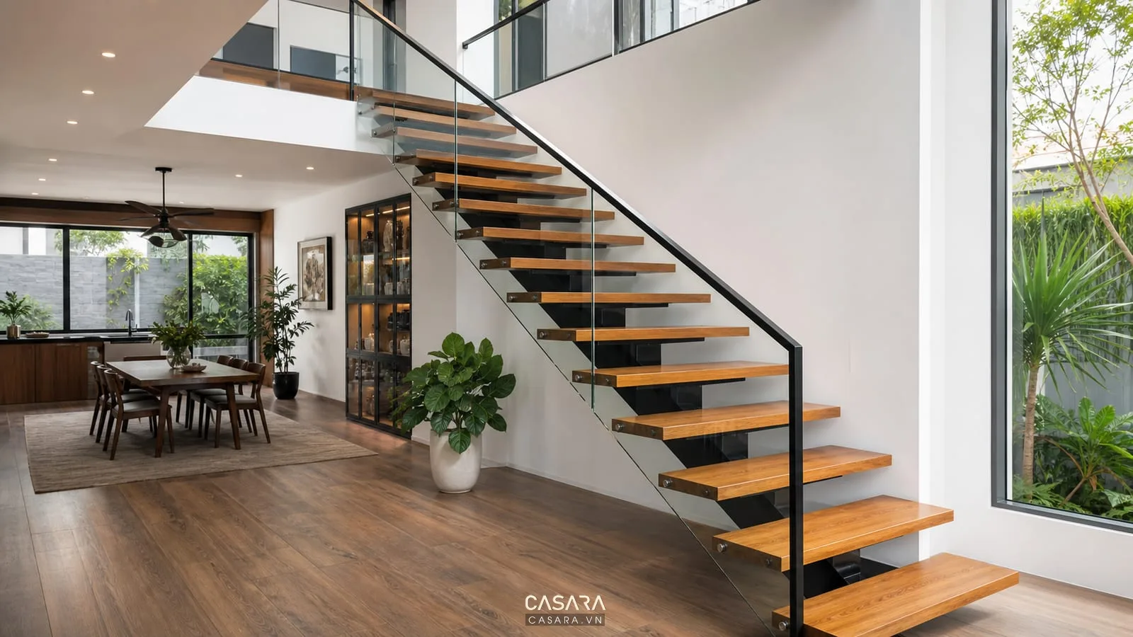 Cầu thang xương cá hiện đại bậc gỗ khung sắt lan can kính
