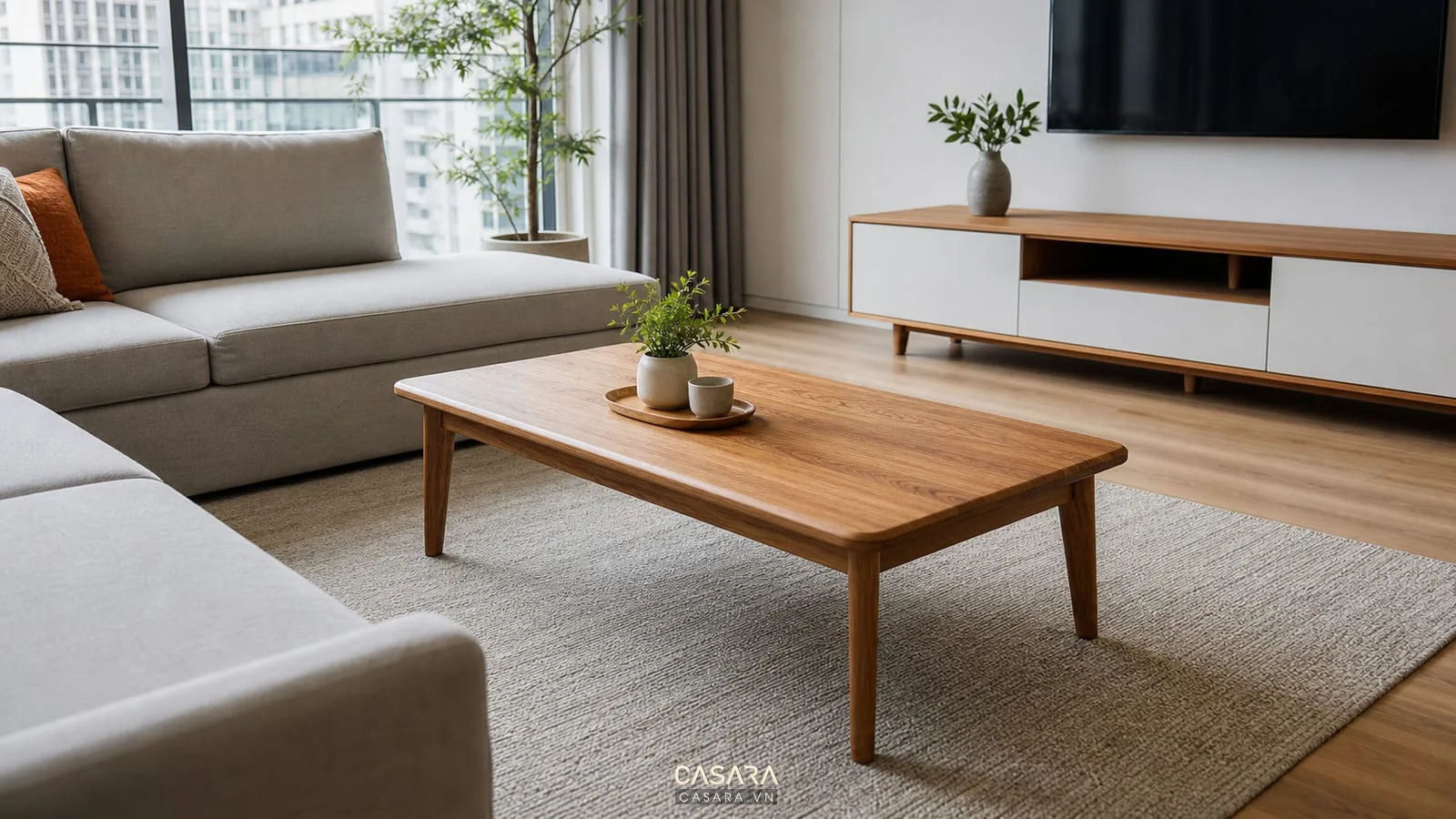 bàn trà gỗ phòng khách hiện đại dáng chữ nhật bo góc trước sofa chữ L màu xám nhạt