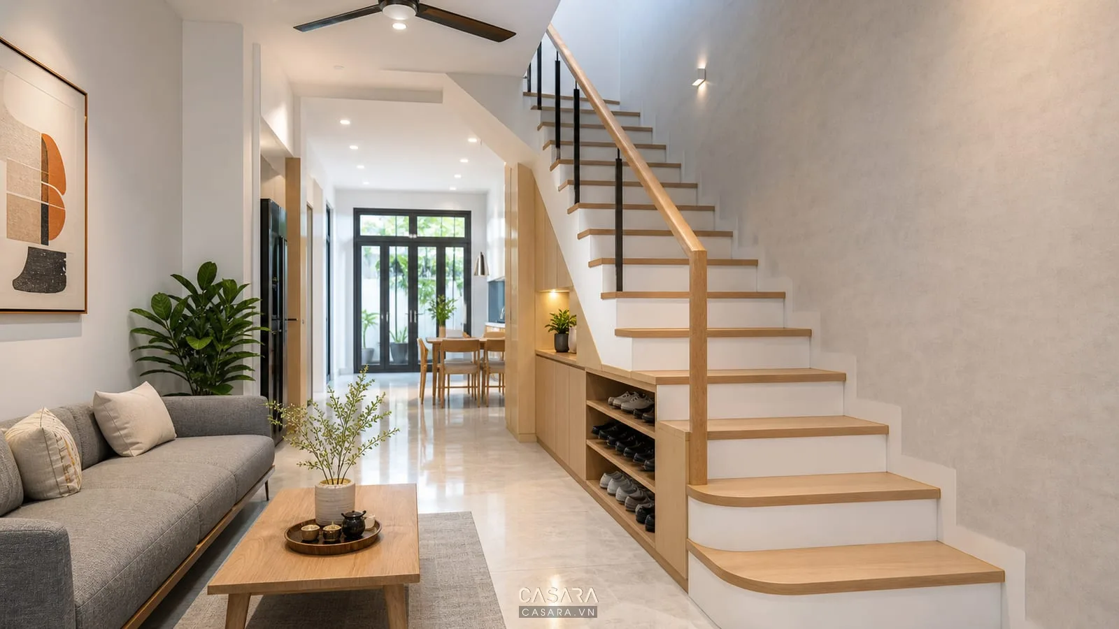 mẫu cầu thang nhà ống hẹp áp tường với bậc gỗ và tủ gầm thang