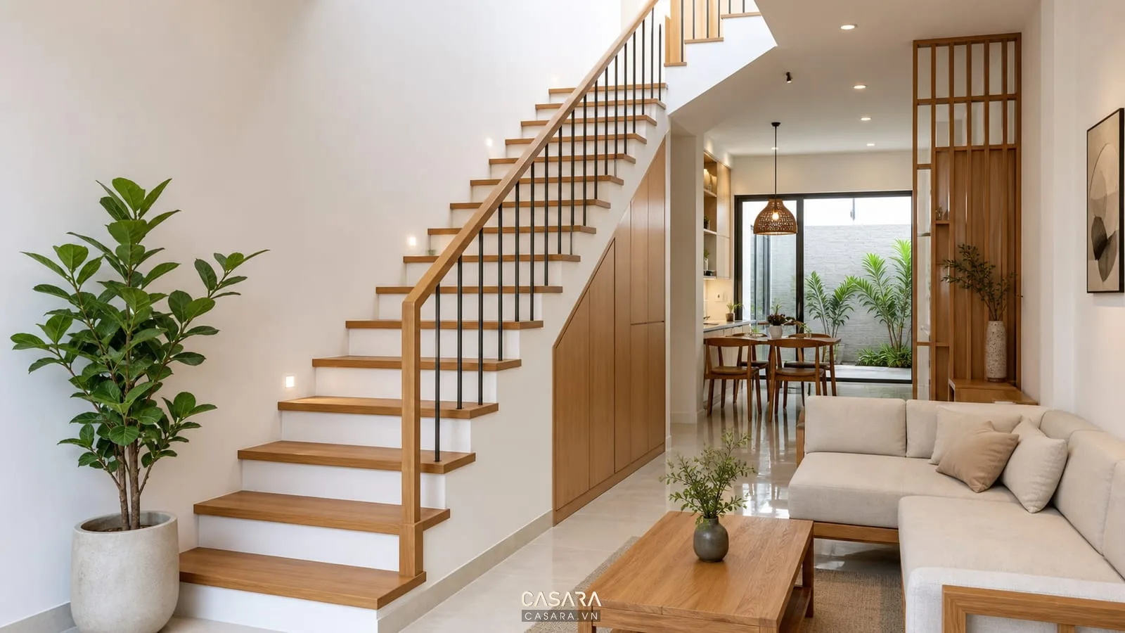 Mẫu cầu thang gỗ đẹp cho nhà ống với tay vịn mảnh và tường trắng