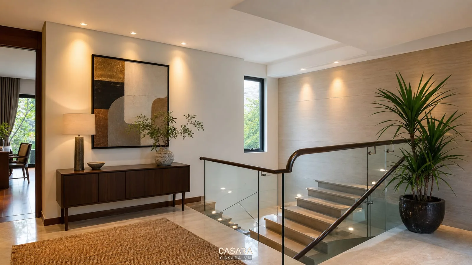 Trang trí góc cầu thang đẹp bằng tranh tường và đèn hắt ấm