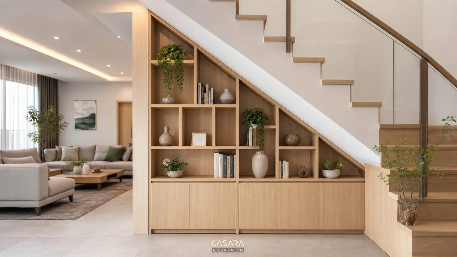 Trang trí dưới chân cầu thang căn hộ duplex với tủ thấp kệ trang trí sofa và ánh sáng ấm