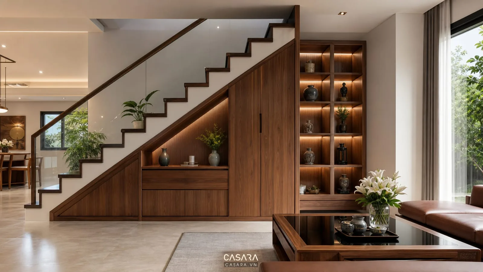 Gầm cầu thang được trang trí đẹp với tủ âm và kệ gỗ hiện đại