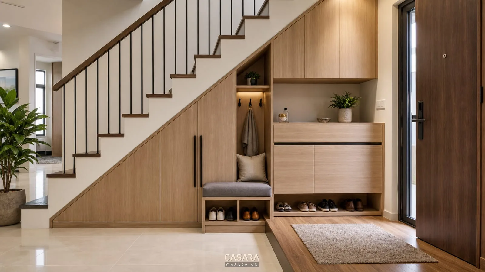 cách bố trí gầm cầu thang đẹp với kệ trang trí gỗ kính và đèn led ấm
