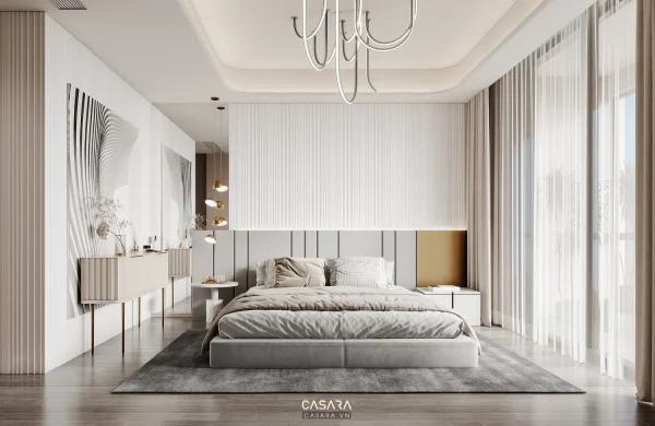 Phòng ngủ hiện đại tông trắng xám với giường thấp, rèm voan và vách đầu giường kẻ dọc