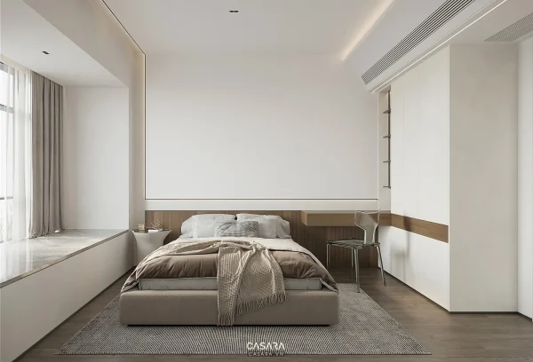 Phòng ngủ hiện đại có giường thấp, tủ âm tường trắng và bàn làm việc nhỏ bên cạnh