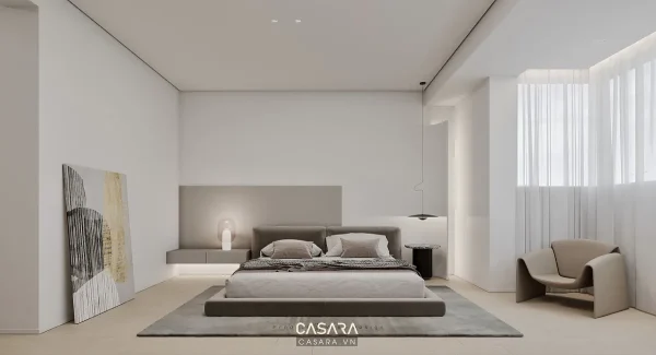 Phòng ngủ hiện đại với giường thấp, rèm trắng và ghế thư giãn cạnh cửa sổ