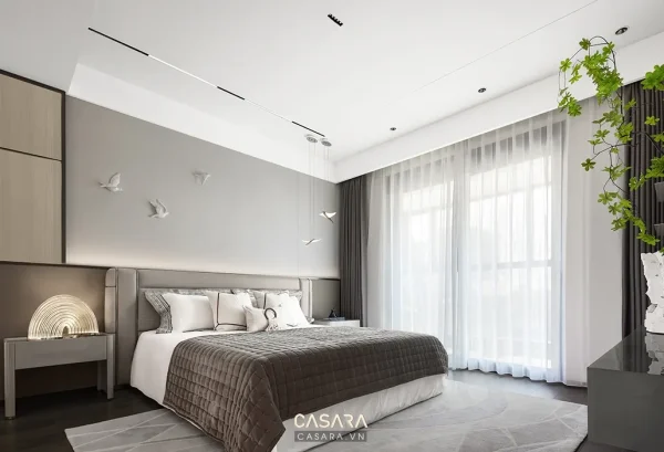 Phòng ngủ hiện đại với giường bọc nệm, rèm trắng và cửa sổ lớn
