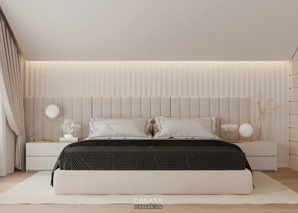 Phòng ngủ hiện đại với giường lớn, đầu giường bọc nệm và ánh sáng hắt tường