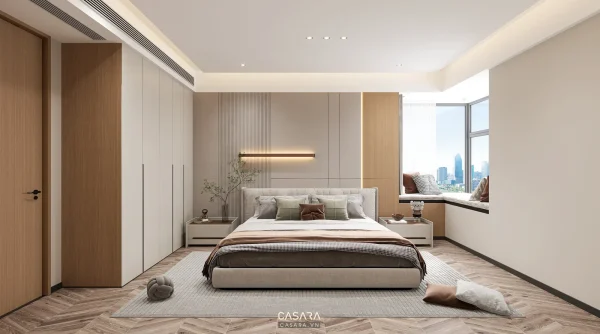 Phòng ngủ hiện đại có giường bọc nệm, tủ âm tường và ghế nghỉ bên cửa sổ