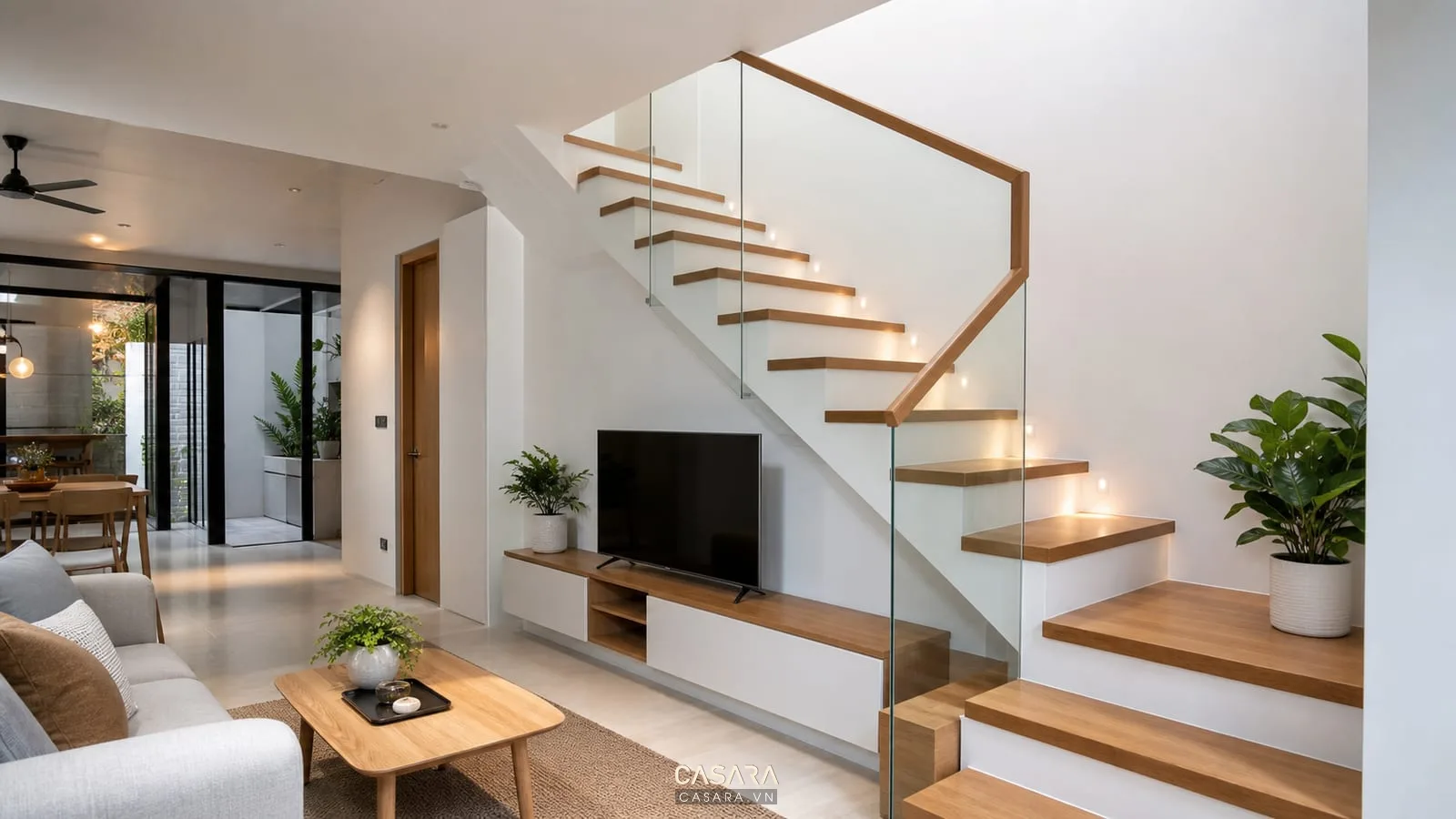 cầu thang đẹp hiện đại với bậc gỗ lan can kính và phòng khách sáng