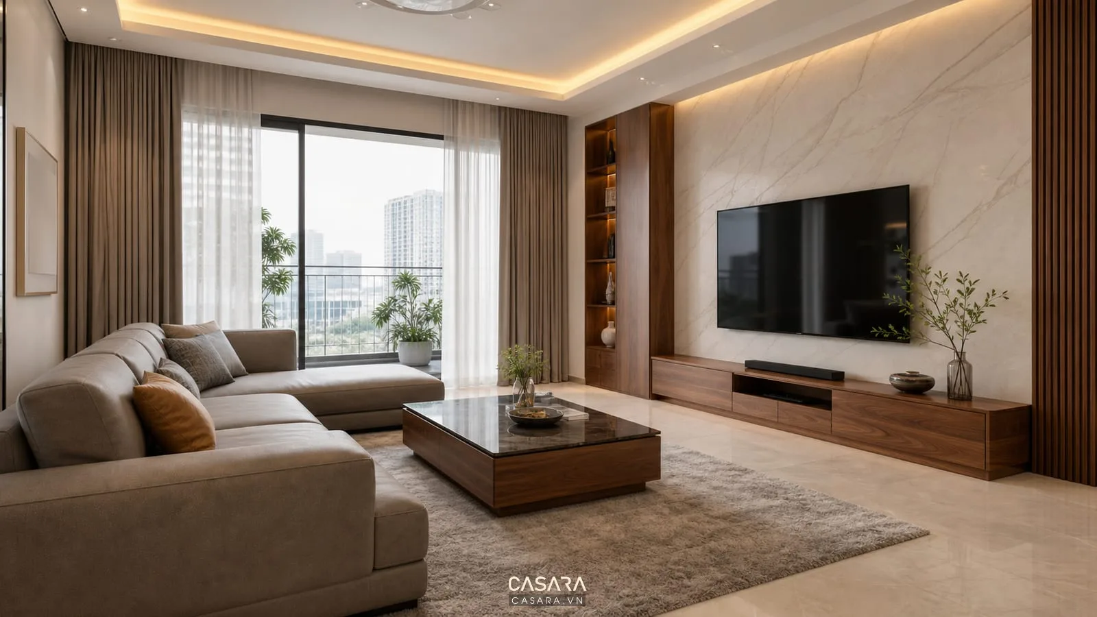 Căn hộ sang trọng có phòng khách sofa chữ L xám ấm kệ tivi gỗ óc chó tường đá vân nhẹ đèn hắt trần và thảm lớn