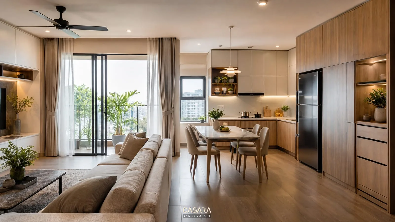 Thiết kế nội thất chung cư với phòng khách bếp mở, sofa, bàn ăn, tủ bếp chữ L và logia sáng