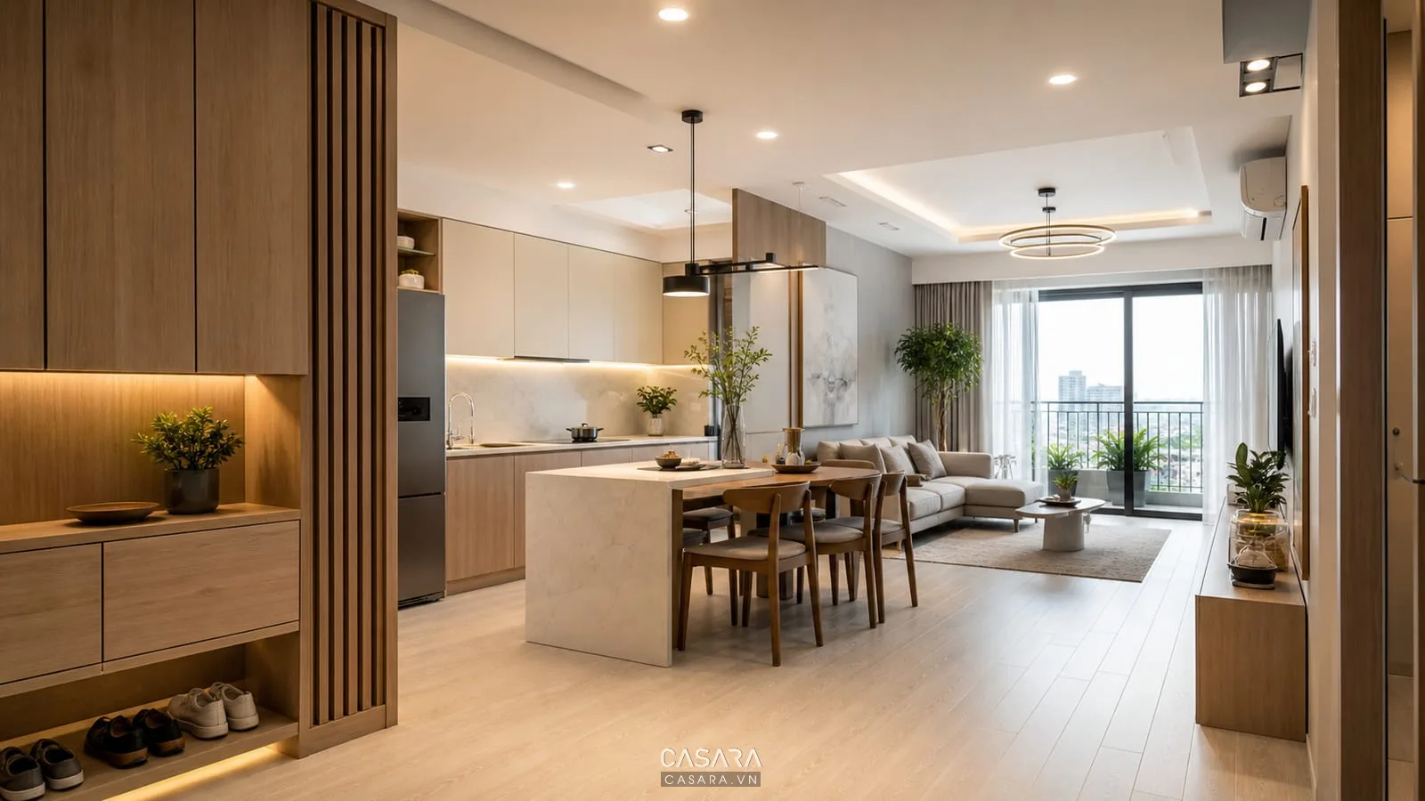 Căn hộ chung cư phòng khách bếp mở có tủ giày ổ cắm đèn trần và ban công sáng