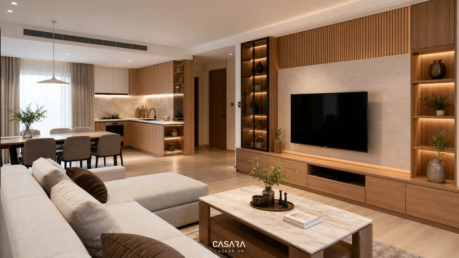 Phòng khách bếp căn hộ hoàn thiện liên quan đến đơn giá thiết kế chung cư với sofa kệ tivi tủ lưu trữ và ánh sáng ấm
