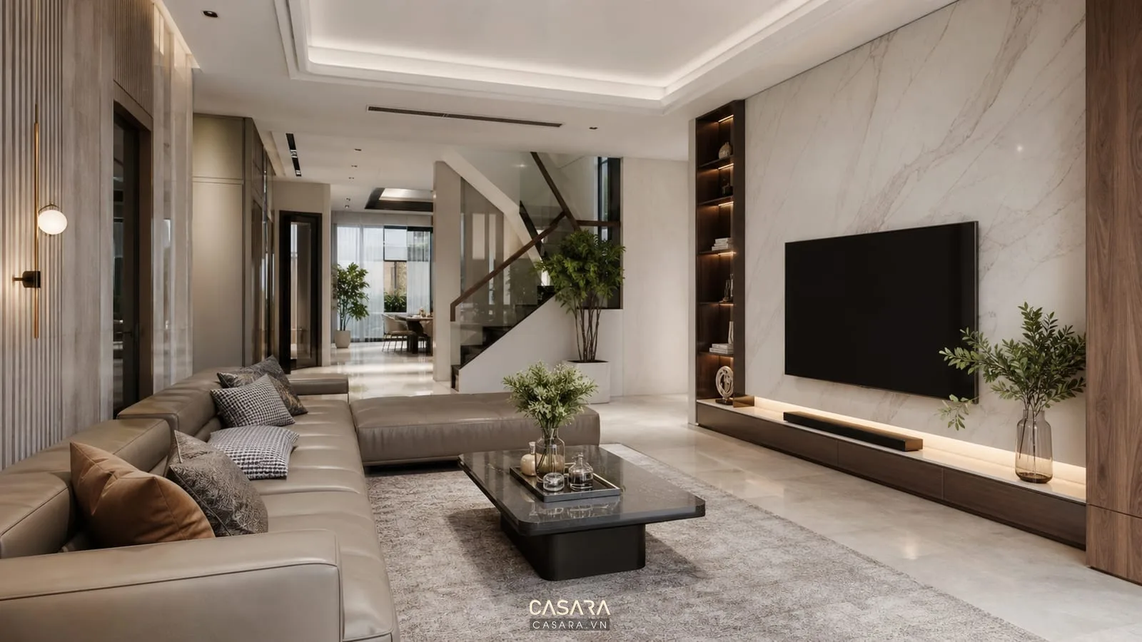 phòng khách sang trọng có sofa da, vách tivi đá và bàn trà hiện đại