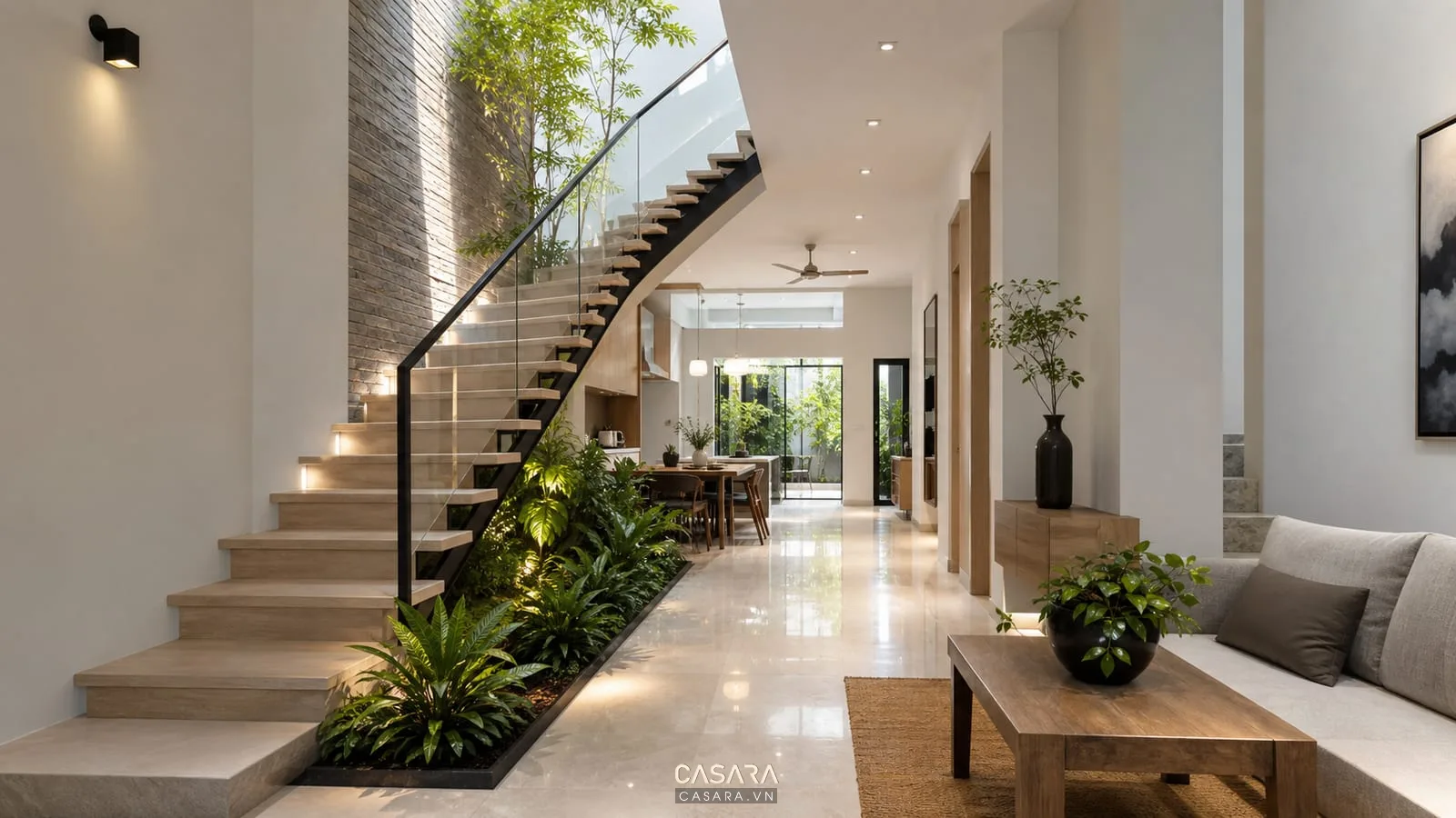cầu thang nhà ống có giếng trời và cây xanh dưới gầm thang