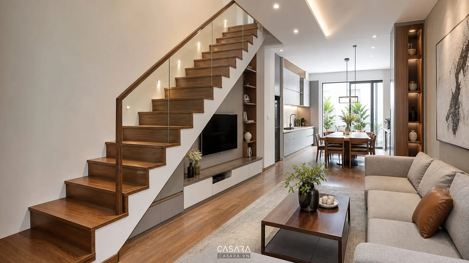 cầu thang gỗ nhà ống lan can kính cạnh phòng khách bếp hiện đại