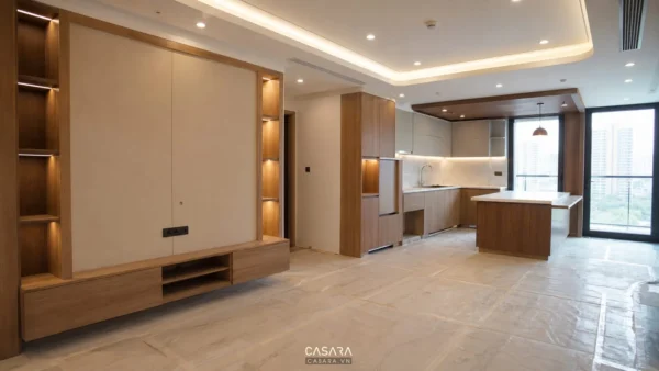 Phòng khách bếp căn hộ chung cư đang thi công nội thất với hệ tủ gỗ và trần đèn hắt