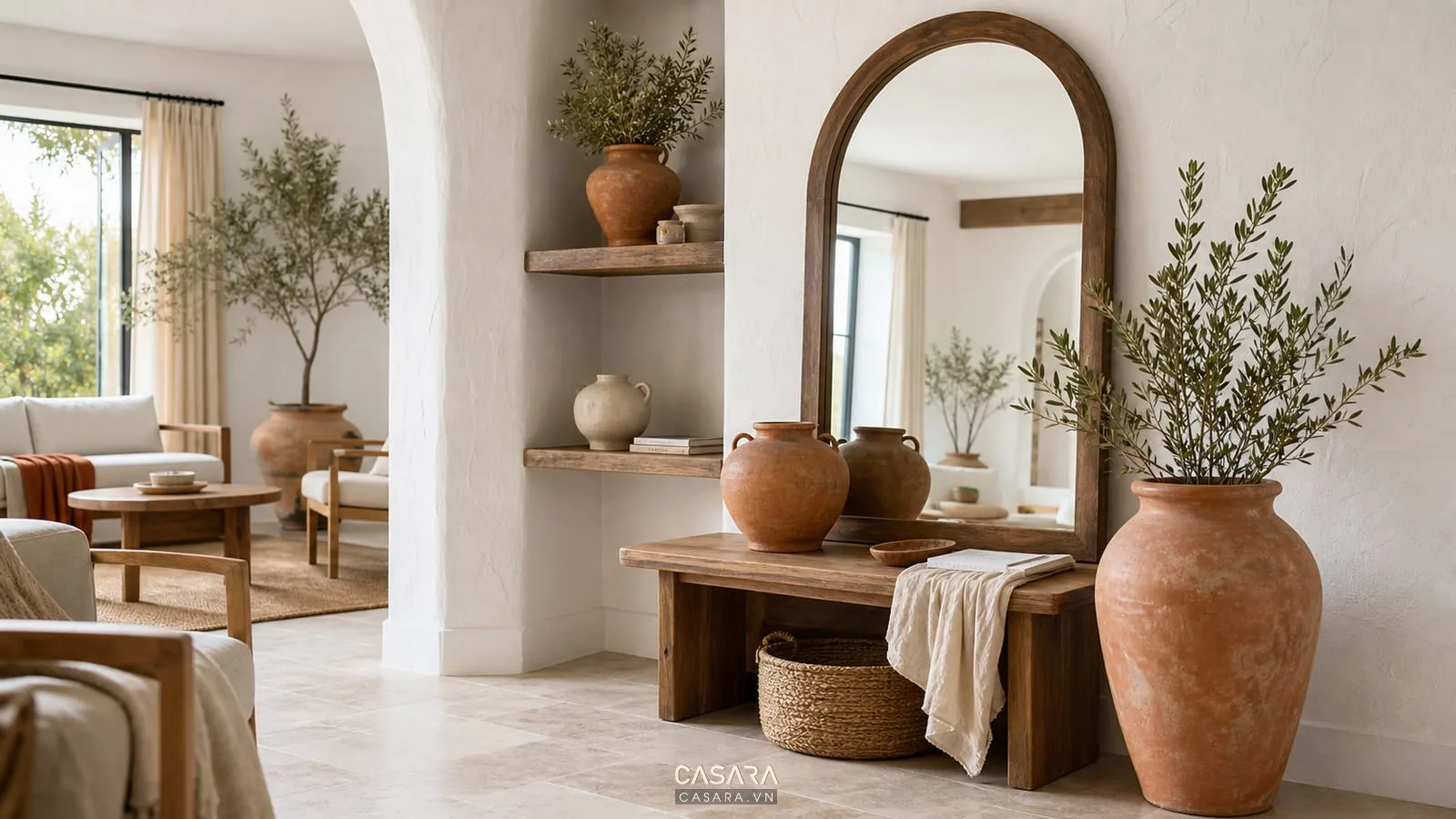 góc decor phong cách địa trung hải với bình gốm đất nung gương vòm kệ gỗ và vải linen