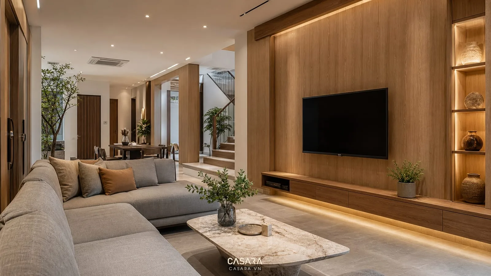 phòng khách đẹp với vách tivi đá vân tủ gỗ sofa trung tính và rèm cao